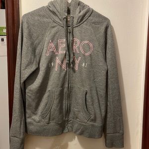 Aeropostale NY 1987 gray hoodie with pink letters in size large, fits loose.